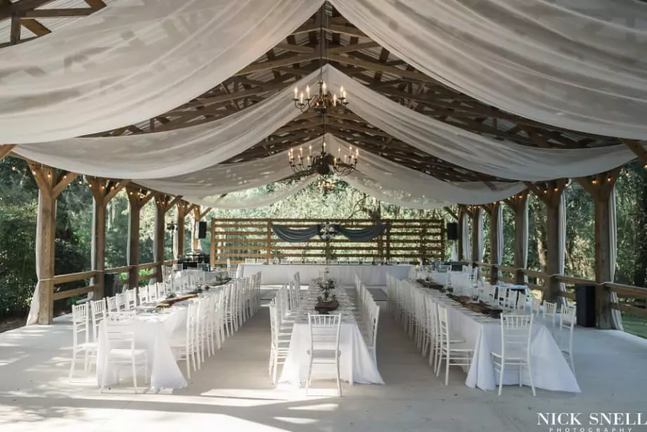 Outdoor wedding pavilion decorated in white