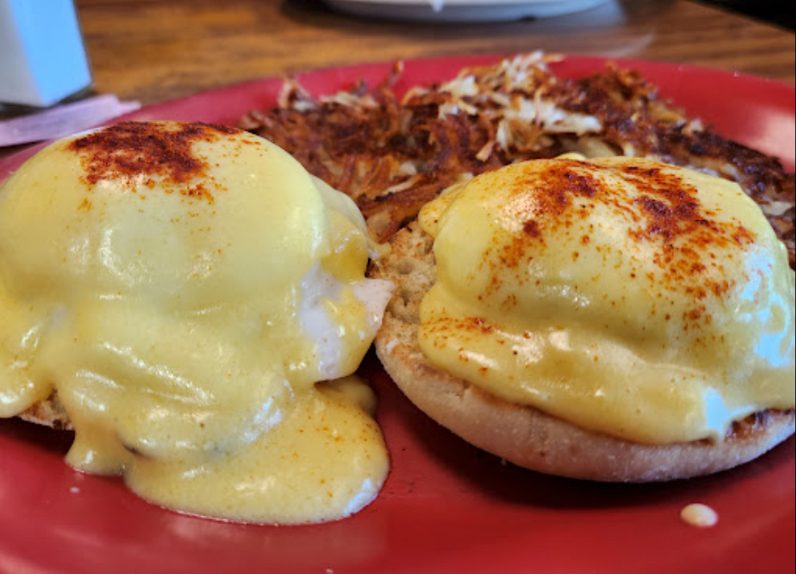 Breakfast plate of Eggs Benedict with Hash Browns
