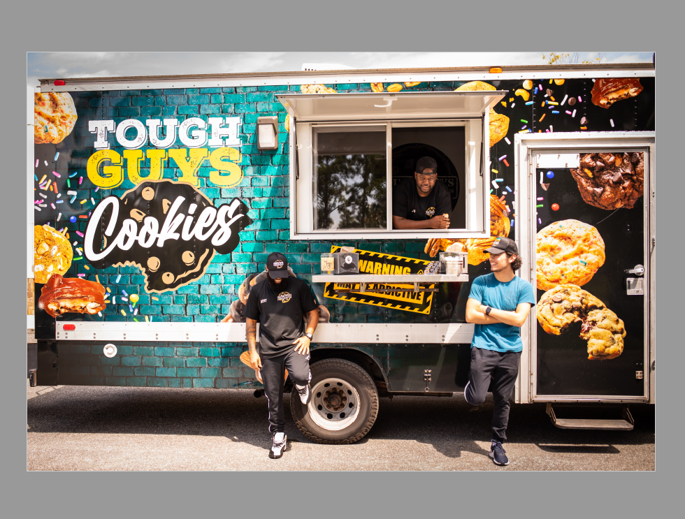 Tough Guys Cookies and Sweets Tough Guys Cookies and Sweets began with a couple guys who love to bake and make others smile with their delicious creations. We specialize in all things SWEETS - catering, shipping, corporate orders, and (launching 10/30!) local delivery to the Jacksonville, FL area! We are not a storefront open to the public. Find our cookie truck locations for the week on our website: toughguyscookies.com. Ask us about cookie truck private booking! Tough Guys Cookies is committed to making you feel great. Whether it's a smile that we gave while hand delivering you your dozen, or the carefully packaged cookie gift box you gleefully unwrap, we always want to do everything with positivity, excitement, and joy. Eat Cookies First!