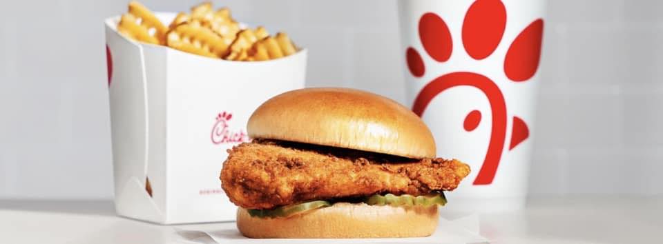 Chicken sandwich, waffle fries, and a drink.