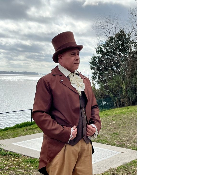 Man dressed in historic outfit standing in front of St. John's River