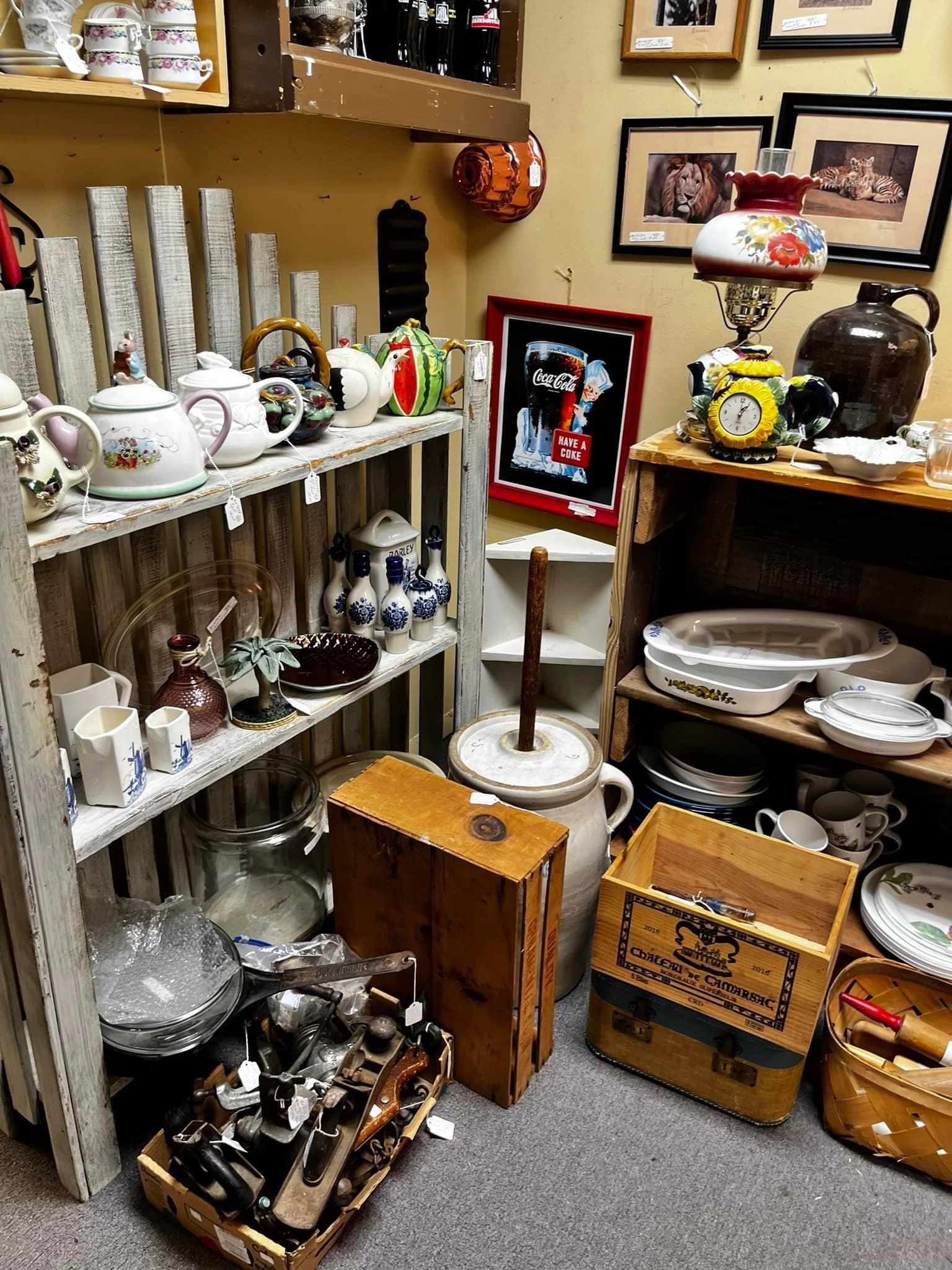 assortment of antique and vintage items including a tea pot, lamp, home decor, and more trinkets