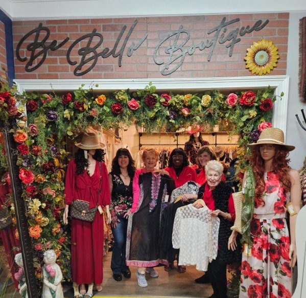women shopping and holding clothing
