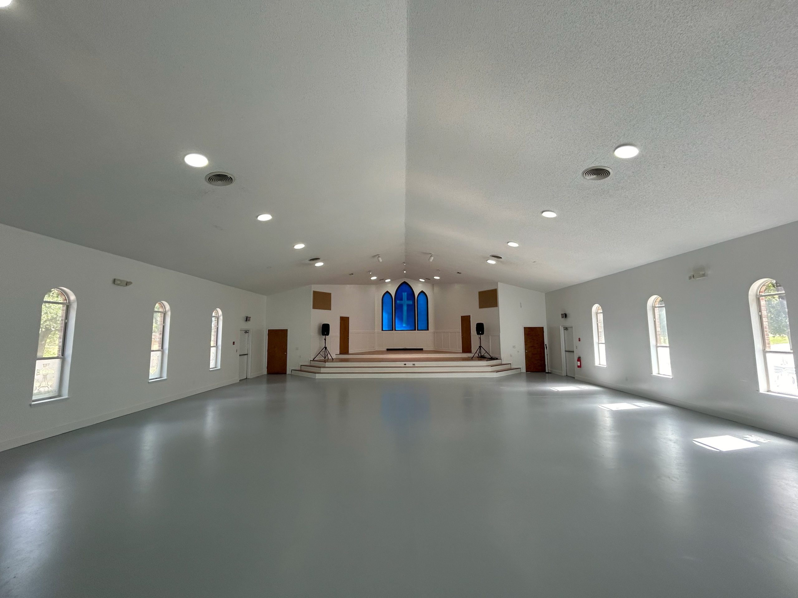 large indoor open space with church windows venue rental