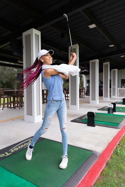 Women swinging at Top of the Tee Golf in Fleming Island