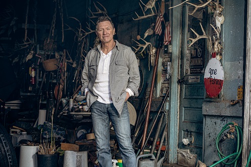 Craig Morgan Feature Photo Photo of Country music singer Craig Morgan standing in a garage.
